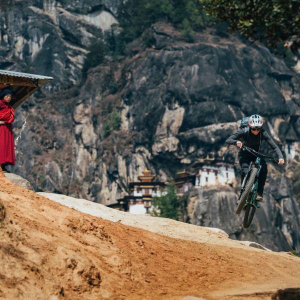 Rider flying down the Tigers nest trail in the Paro valley of Bhutan
