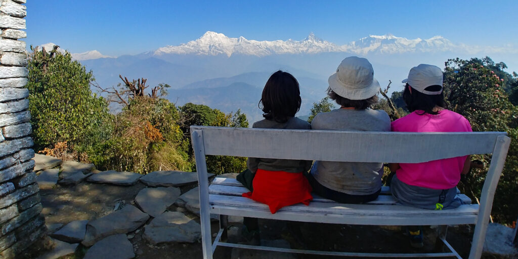 Trekkers enjoying the view of Dhaulagiri and the Annapurnas from Panchase top on the Panchase trek in Nepal