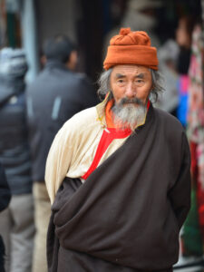 Tibetan pilgrim at the Boudhanath stupa in the Kathmandu valley, Nepal