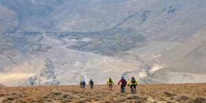Riders descending from Lupra to Ekle Bhatti in the Kali Gandaki valley of Lower Mustang. Across the valley is hte village of Phallyak