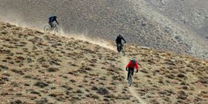 Mountain bikers on the super single trail down to Lupra in lower Mustang on the Annapurna circuit