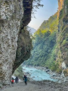 Mountain bikers near the end of the Annapurna circuit at Galeshwor